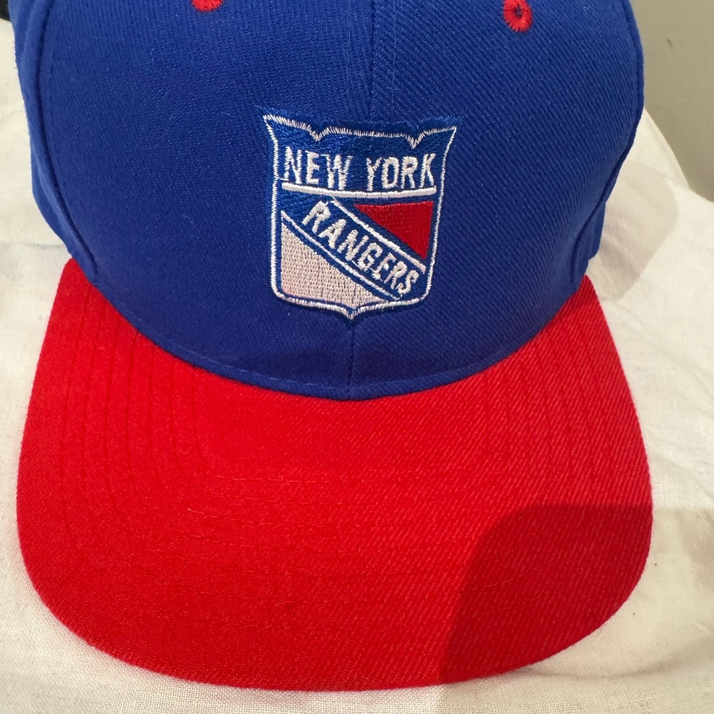 New York Rangers Blue and Red Cap snap back. Perfect condition.nwot